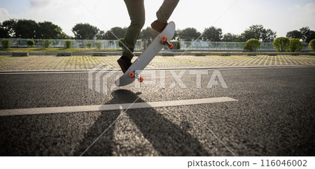 Skateboarder skateboarding outdoors in city 116046002