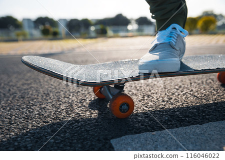 Skateboarder skateboarding outdoors in city 116046022