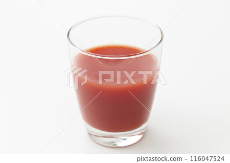 Tomato juice in a glass on a white background Tomato juice in a glass on a white background 116047524