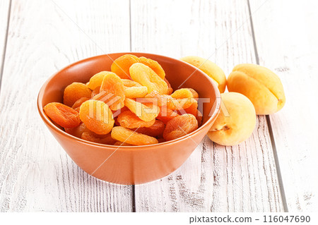 Dried apricot heap in the bowl 116047690