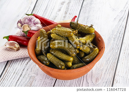 Marinated small cucumbers in the bowl Marinated small cucumbers in the bowl 116047728