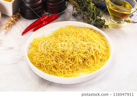 Raw dry Italian pasta Vermicelli 116047911