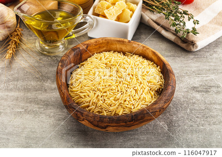 Italian raw dry pasta risoni 116047917