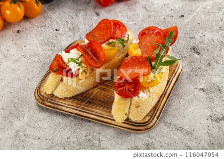 Bruschetta tapas with chorizo and tomato 116047954