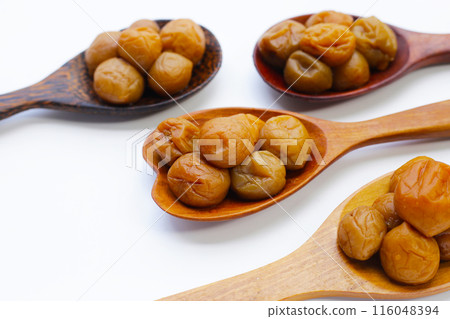 Pickled plums on white background. Pickled plums on white background. 116048394