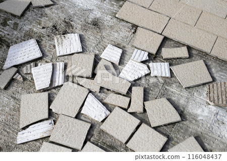 Cracked brown tiles on cement floor Cracked brown tiles on cement floor 116048437
