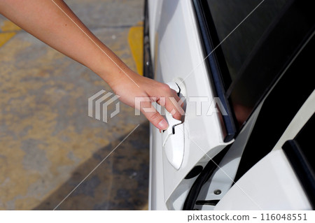 Male hand opening car door 116048551