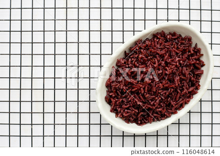 Cooked black rice in white bowl Cooked black rice in white bowl 116048614