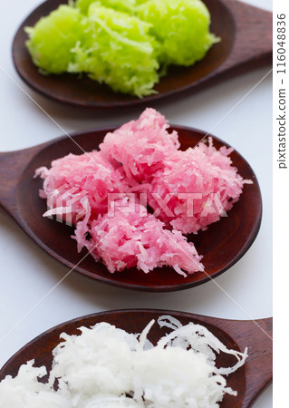 Sweet coconut balls, crispy coconut candies (Maprao Gaew). Thai traditional dessert Sweet coconut balls, crispy coconut candies (Maprao Gaew). Thai traditional dessert 116048836