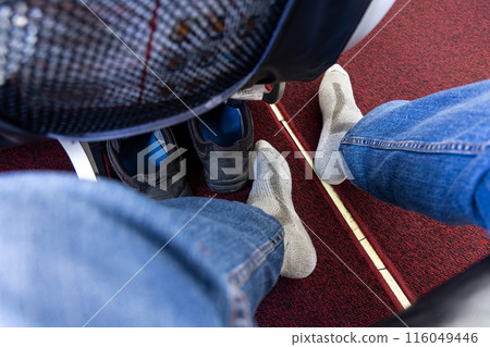 AIrplane passenger removed shoes in cabin to relax feet during long haul flight 116049446