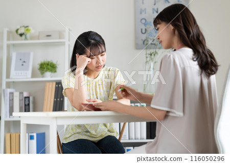 A young woman who consults with her worries 116050296