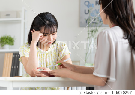 A young woman who consults with her worries A young woman who consults with her worries 116050297