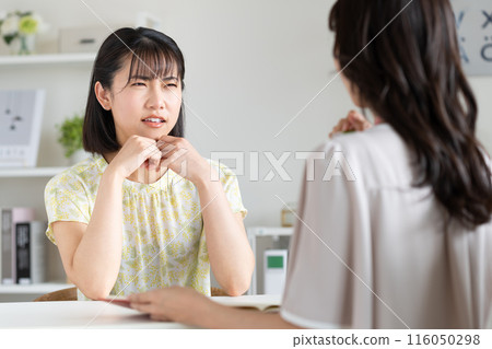 A young woman who consults with her worries A young woman who consults with her worries 116050298