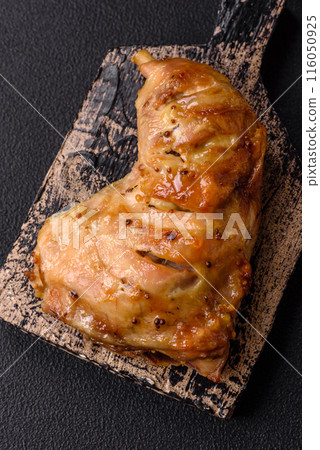 Delicious grilled chicken leg or quarter with salt and spices 116050925