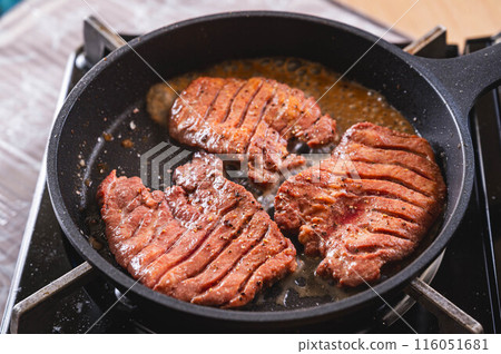 Beef tongue roasted in a frying pan 116051681