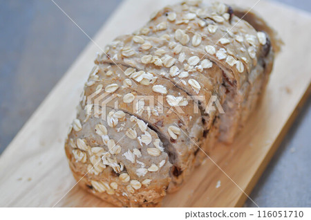 bread , whole wheat bread or sourdough bread or loaf of bread or cranberry and whole grain bread in the tray 116051710