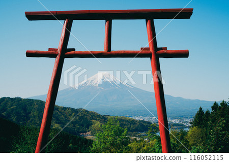 A woman prays at a shrine dedicated to Mount Fuji 116052115