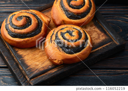 Homemade bun with poppy seeds Homemade bun with poppy seeds 116052219