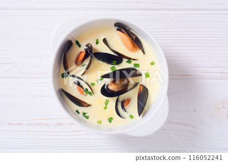 Cream soup with mussels . Sea food background photo 116052241