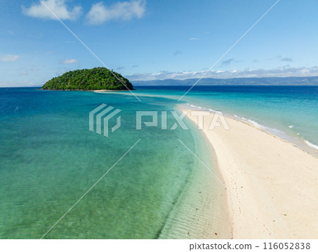 Ocean waves over sandbar in Romblon Island. Blue sky and clouds. Romblon, Philippines. Ocean waves over sandbar in Romblon Island. Blue sky and clouds. Romblon, Philippines. 116052838