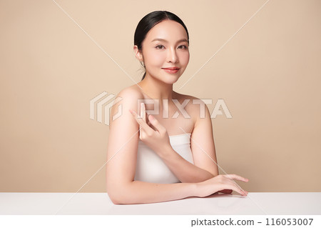 Beautiful young asian woman with clean fresh skin on beige background, Face care, Facial treatment, Cosmetology, beauty and spa, Asian women portrait. 116053007