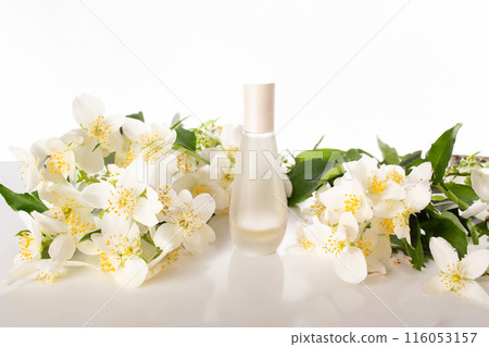 Jasmine essential and Jasmine flowers on white background. Hair treatment concept. Close up 116053157