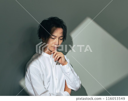 A man with a thoughtful expression 116053549