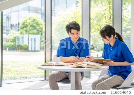 Male and female caregivers studying 116054640