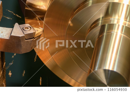 Close up scene the lathe machine finish cut the brass material parts. Close up scene the lathe machine finish cut the brass material parts. 116054930