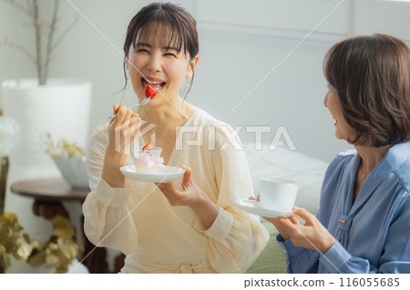 Two women having a conversation in a cafe Two women having a conversation in a cafe 116055685