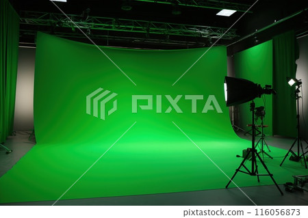 Green screen studio with lighting and equipment for multimedia content creation in photography and filmmaking 116056873