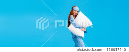 Tenderness, comfort and coziness concept. Full-length vertical shot tender and feminine lovely redhead girl in nightwear, sleep mask, hugging pillow giggling flirty and gazing camera with smile Tenderness, comfort and coziness concept. Full-length vertical shot tender and feminine lovely redhead girl in nightwear, sleep mask, hugging pillow giggling flirty and gazing camera with smile 116057240