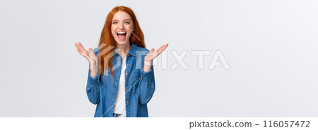 Cheerful, happy and optimistic alluring redhead teenage girl clap hands and laughing from amazement, having fun, enjoy watching funny stand-up comedy performance, white background 116057472