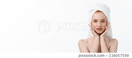 beautiful model applying cosmetic cream treatment on her face on white. beautiful model applying cosmetic cream treatment on her face on white. 116057500