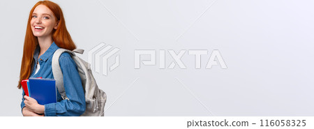 Students, education and studying concept. Lovely charismatic redhead foxy girl with backpack, notebooks and study books, standing white background, smiling joyful looking camera 116058325