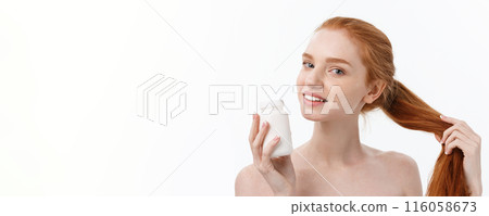 Portrait of good-looking young caucasian woman holding pills, trying to take care of immune system and health over gray background. Portrait of good-looking young caucasian woman holding pills, trying to take care of immune system and health over gray background. 116058673