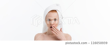 Surprised Beautiful Young Woman After Bath with A Towel On Her Head Isolated On white Background. Skin Care And Spa Theme. 116058939