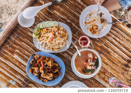 Lunch set of Thai seafood served on local bamboo table. 116059719