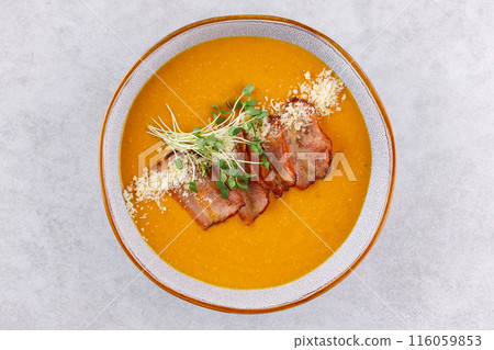 Red lentil soup puree on stone table. Top view. Red lentil soup puree on stone table. Top view. 116059853