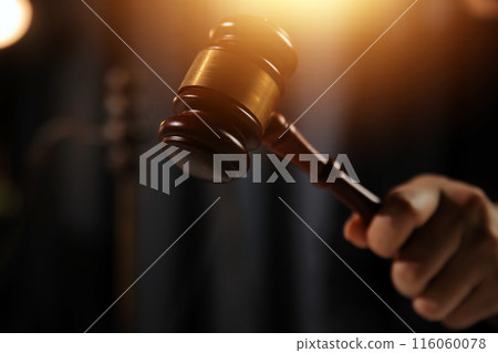 Law theme, gavel or mallet of the judge, lawyer enforcement officers, evidence-based cases taken into account in the court abount business, legislation. Law theme, gavel or mallet of the judge, lawyer enforcement officers, evidence-based cases taken into account in the court abount business, legislation. 116060078