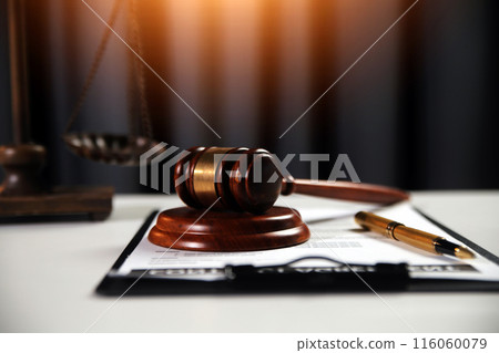 Law theme, gavel or mallet of the judge, lawyer enforcement officers, evidence-based cases taken into account in the court abount business, legislation. Law theme, gavel or mallet of the judge, lawyer enforcement officers, evidence-based cases taken into account in the court abount business, legislation. 116060079