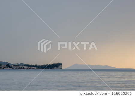 Calm sea and island Othonoi, Greece 116060205