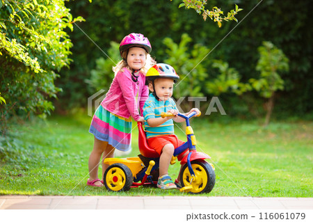 Two children riding bikes 116061079