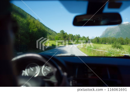 View of the road from inside the car. Traveling by car. View of the road and the panel of the car. 116061691