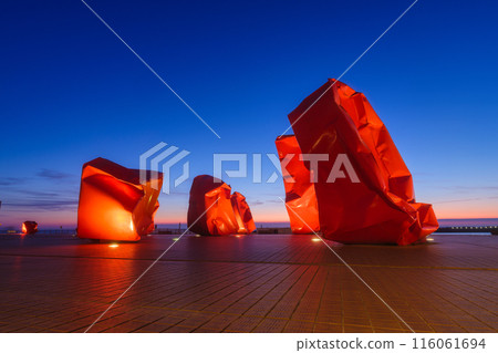 Ostend, Belgium. Modern Design and Monument. View of the pier during sunset. Ostend, Belgium. Modern Design and Monument. View of the pier during sunset. 116061694
