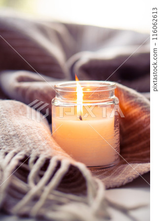 Enhancing home ambience with candles creates a cozy and inviting atmosphere for comfort 116062613