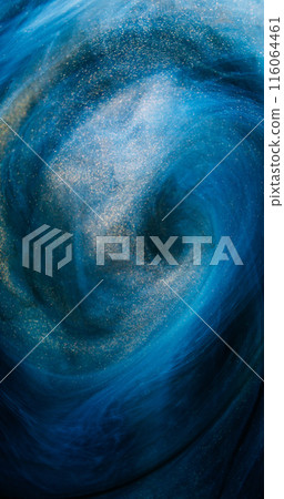 Glitter swirl. Mist vortex. Defocused blue golden color sparkling particles texture paint blend rotation on dark abstract art background. Glitter swirl. Mist vortex. Defocused blue golden color sparkling particles texture paint blend rotation on dark abstract art background. 116064461