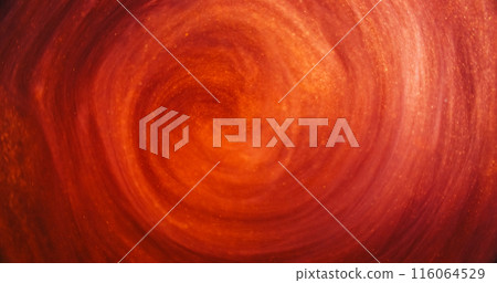 Glitter mist. Ink swirl. Defocused red orange golden color vapor cloud shiny particles texture paint floating in water abstract art background. Glitter mist. Ink swirl. Defocused red orange golden color vapor cloud shiny particles texture paint floating in water abstract art background. 116064529