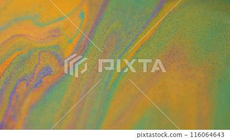 Liquid glitter mix. Marble paint. Blur orange purple green color sparkling metallic sand particles texture ink pigment fluid spill abstract art background. 116064643