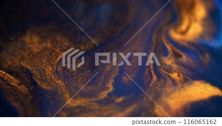 Glitter paint wave. Emulsion splash. Defocused blue golden black color glowing particles texture liquid mix dark abstract art background. Glitter paint wave. Emulsion splash. Defocused blue golden black color glowing particles texture liquid mix dark abstract art background. 116065162